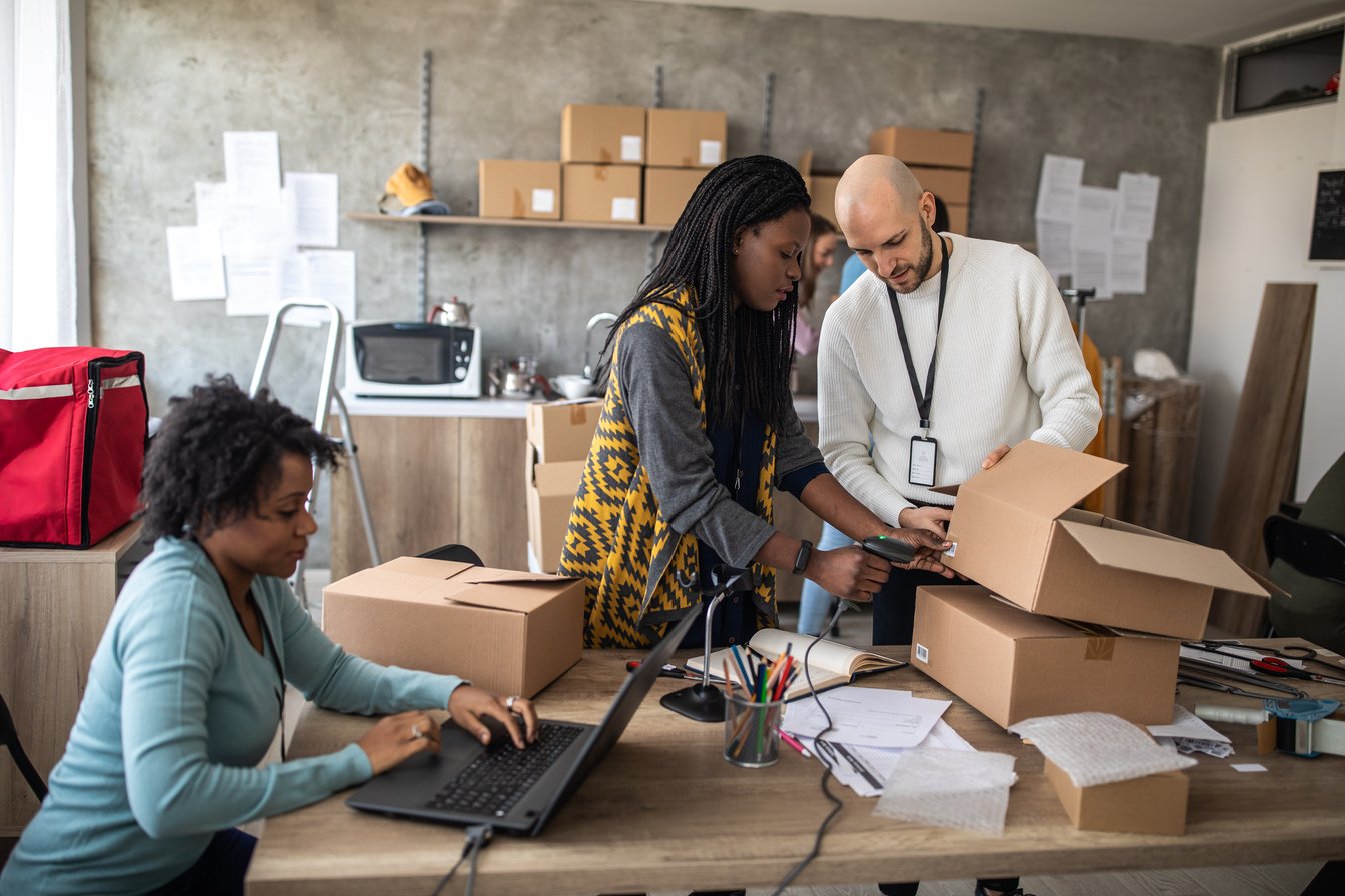 E-commerce workers preparing the delivery box for the customer